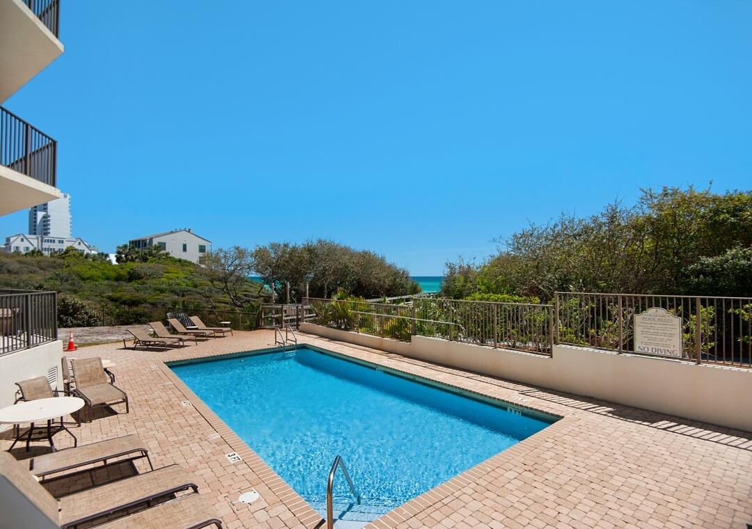 3880 East County Highway 30A, Unit 104 Santa Rosa Beach, FL 32459 - Photo 41 of 49 a view of swimming pool with a lounge chair