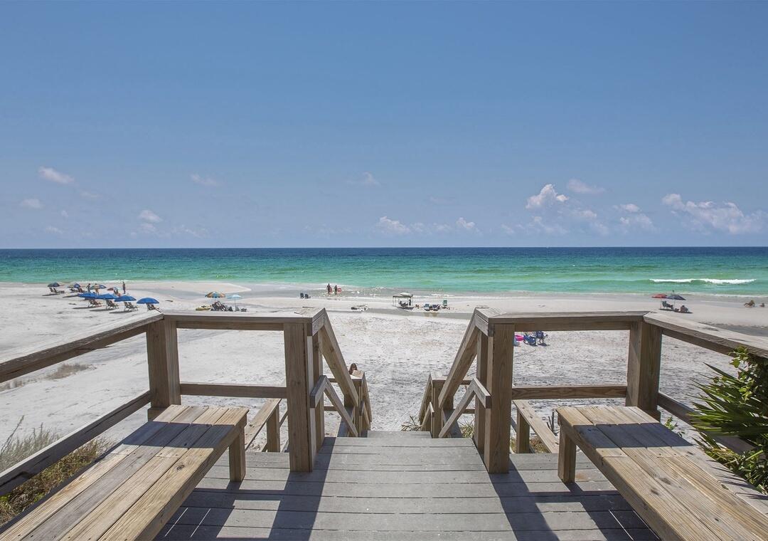 3880 East County Highway 30A, Unit 104 Santa Rosa Beach, FL 32459 - Photo 45 of 49 a view of a chairs and table on the terrace