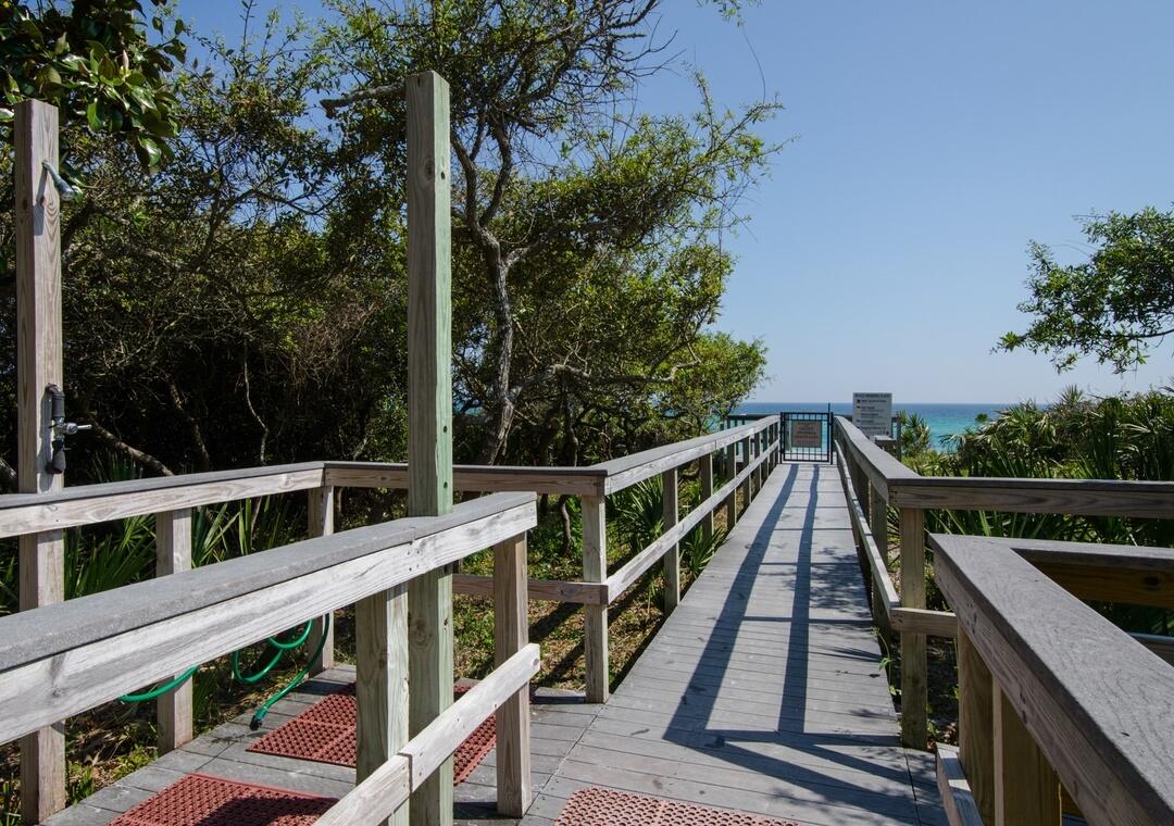 3880 East County Highway 30A, Unit 104 Santa Rosa Beach, FL 32459 - Photo 46 of 49 a view of a balcony with wooden fence and floor
