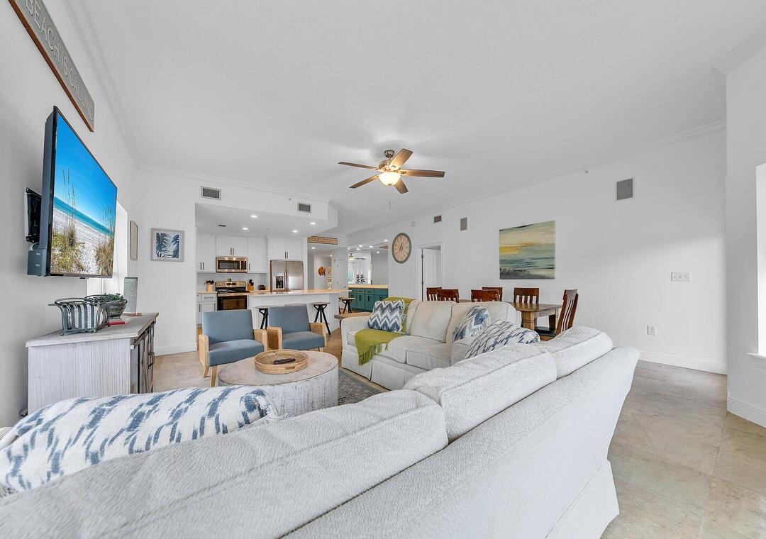 3880 East County Highway 30A, Unit 104 Santa Rosa Beach, FL 32459 - Photo 5 of 49 a living room with furniture and a flat screen tv