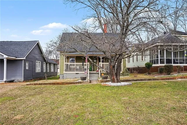 a house view with a sitting space and garden space
