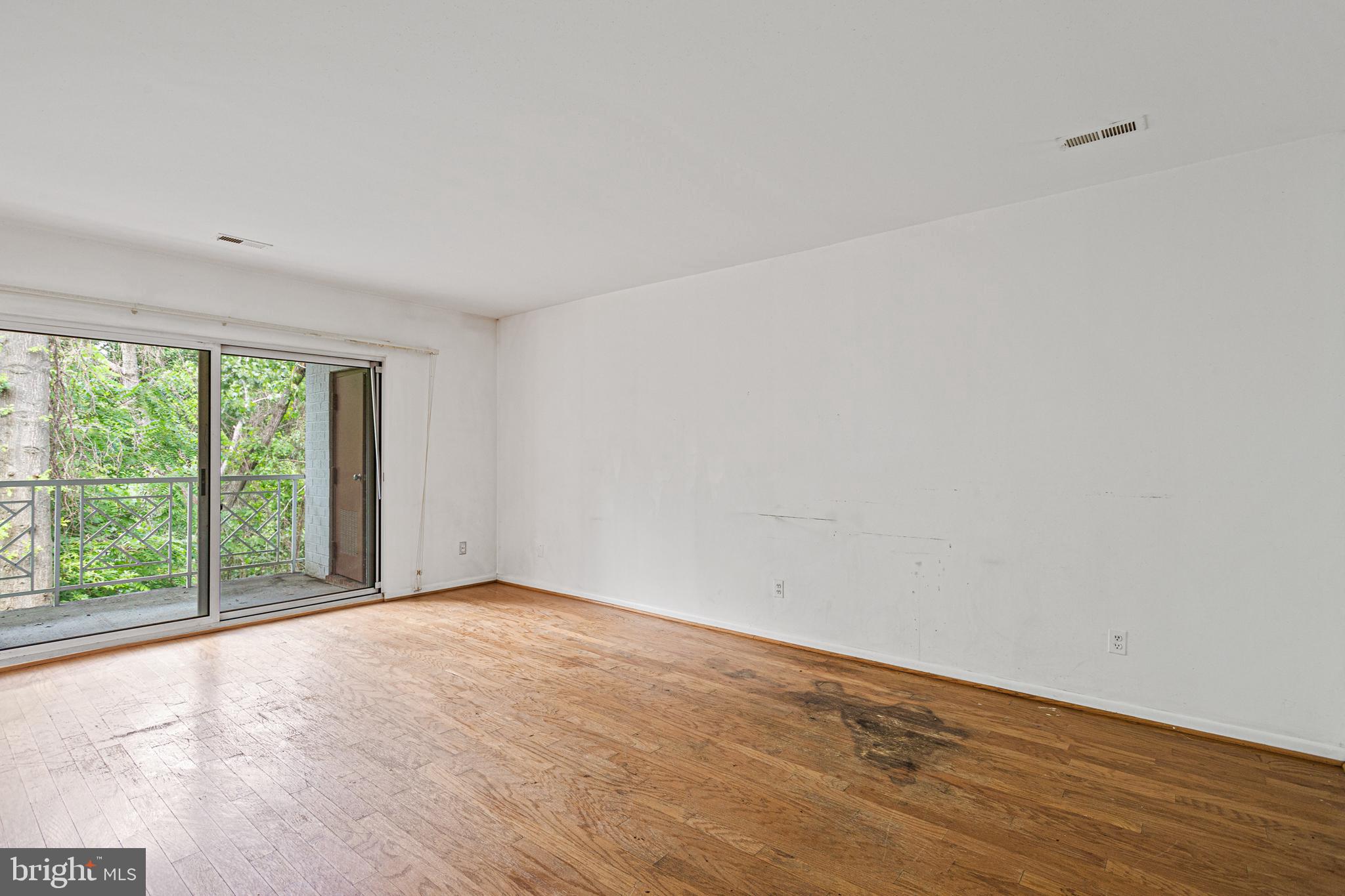 106 Castletown Road, Unit 202 Lutherville-Timonium, MD 21093 - Photo 6 of 13 living room overlooks woods