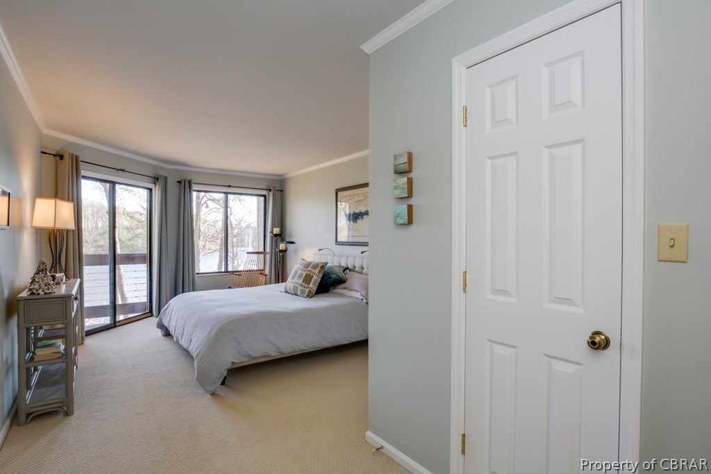 63 Mariners Point Lane, Unit A Hartfield, VA 23071 - Photo 12 of 29 Spacious waterside master suite with walk-in closet and double sliders to the deck