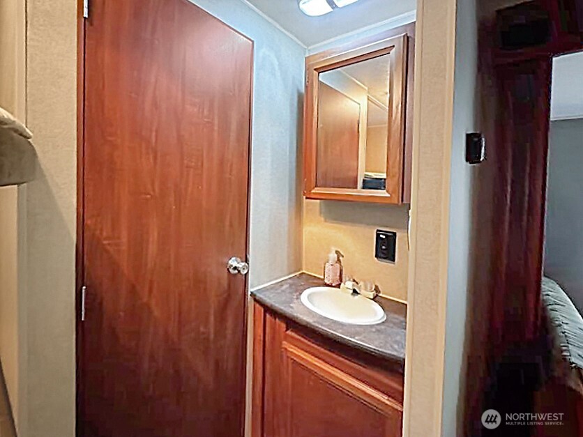 47 Wilderness Way Maple Falls, WA 98266 - Photo 20 of 40 a bathroom with a sink and a mirror