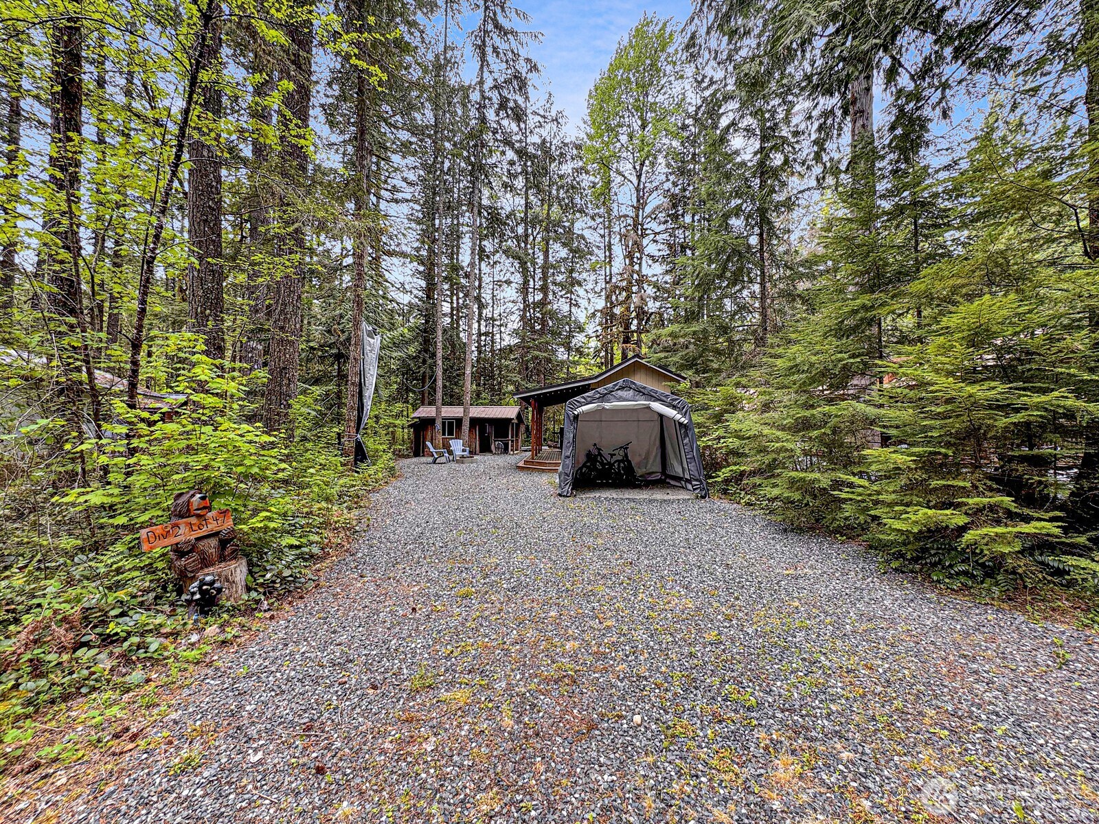47 Wilderness Way Maple Falls, WA 98266 - Photo 2 of 40 a pathway of a house with a yard