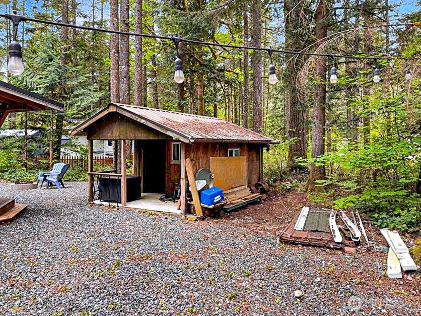 47 Wilderness Way Maple Falls, WA 98266 - Photo 23 of 40 a view of a chair and table in backyard of the house