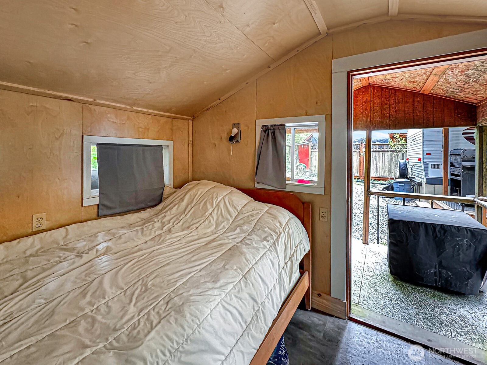 47 Wilderness Way Maple Falls, WA 98266 - Photo 27 of 40 a bedroom with a large bed and a large window