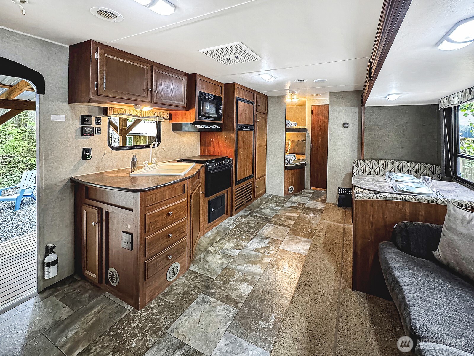 47 Wilderness Way Maple Falls, WA 98266 - Photo 9 of 40 a kitchen with stainless steel appliances granite countertop a stove a sink and a refrigerator