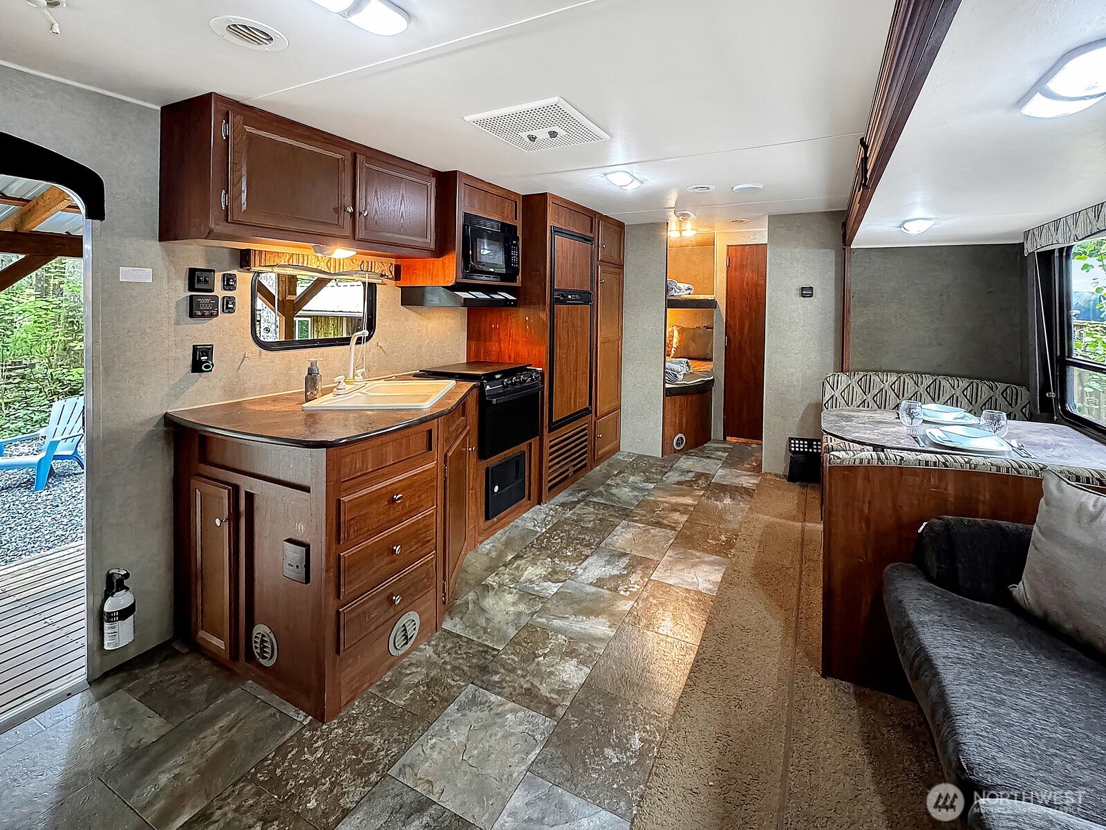 47 Wilderness Way Maple Falls, WA 98266 - Photo 10 of 40 a kitchen with stainless steel appliances granite countertop a stove a sink and a refrigerator