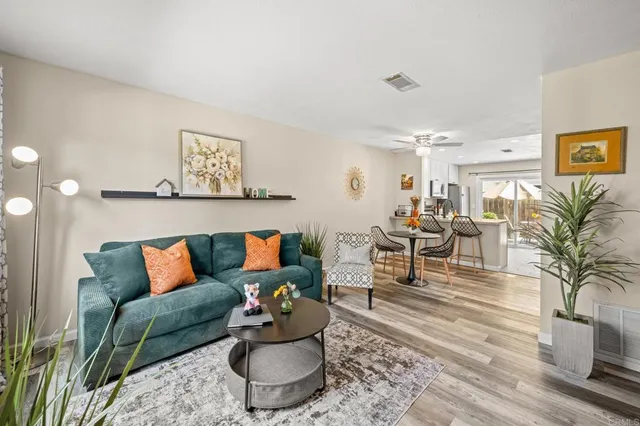 a living room with furniture and a rug