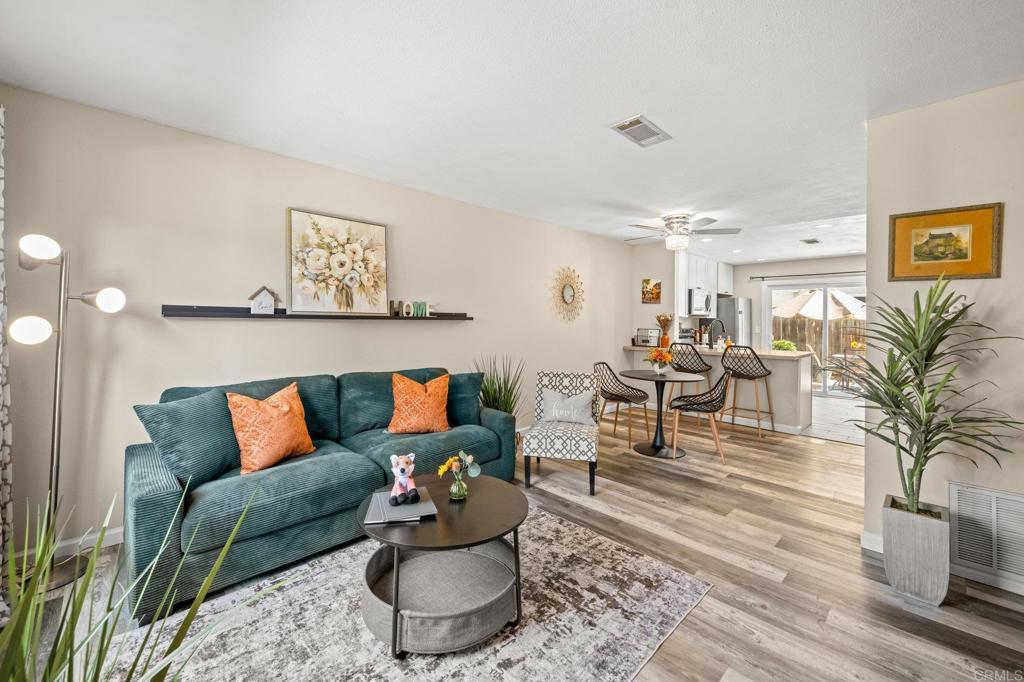 a living room with furniture and a rug