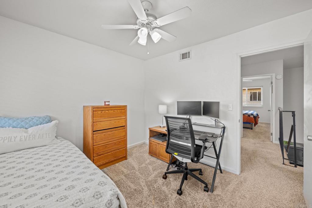 10323 Restful Court Santee, CA 92071 - Photo 13 of 30 a bedroom with a bed and a desk