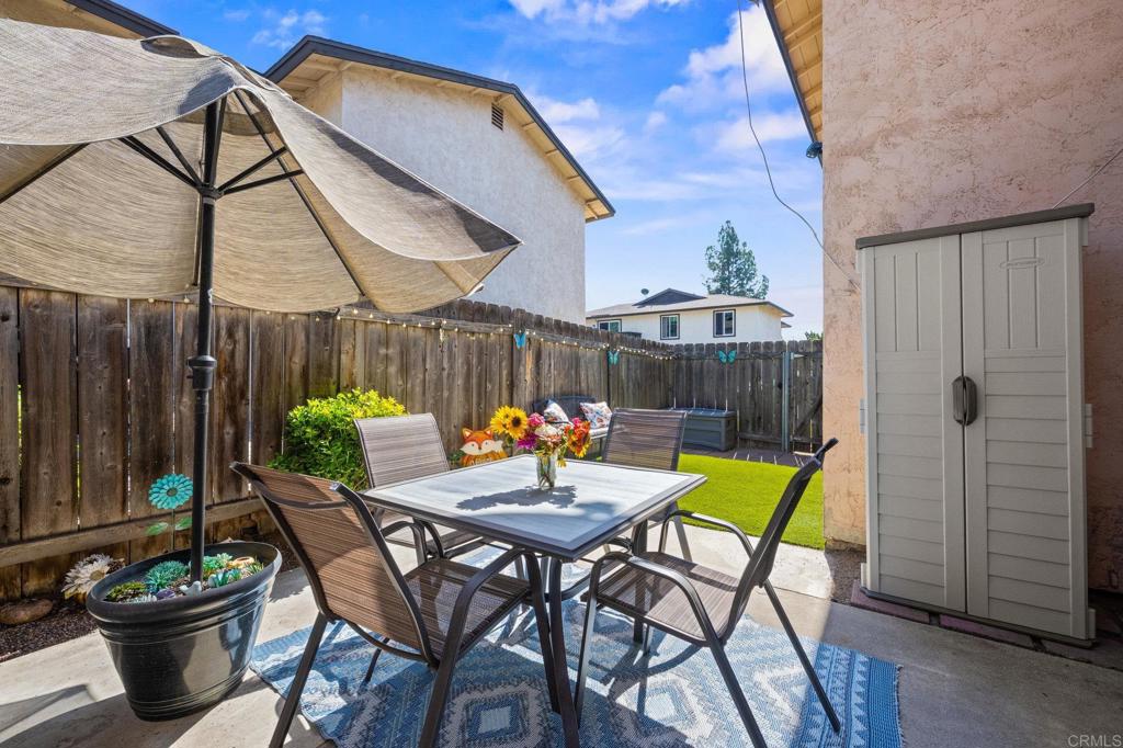 10323 Restful Court Santee, CA 92071 - Photo 14 of 30 a patio with a table and chairs