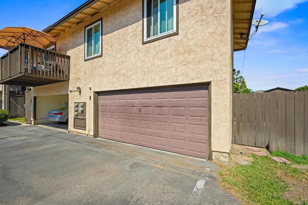 10323 Restful Court Santee, CA 92071 - Photo 17 of 30 a front view of a house with a garage