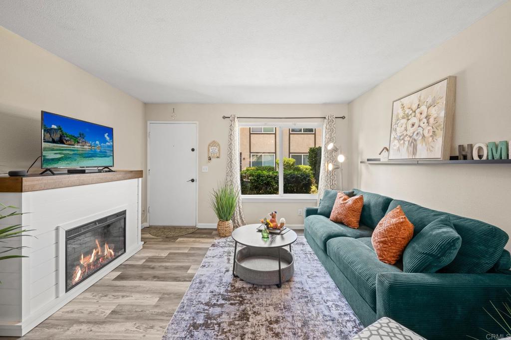 10323 Restful Court Santee, CA 92071 - Photo 2 of 30 a living room with furniture and a fireplace
