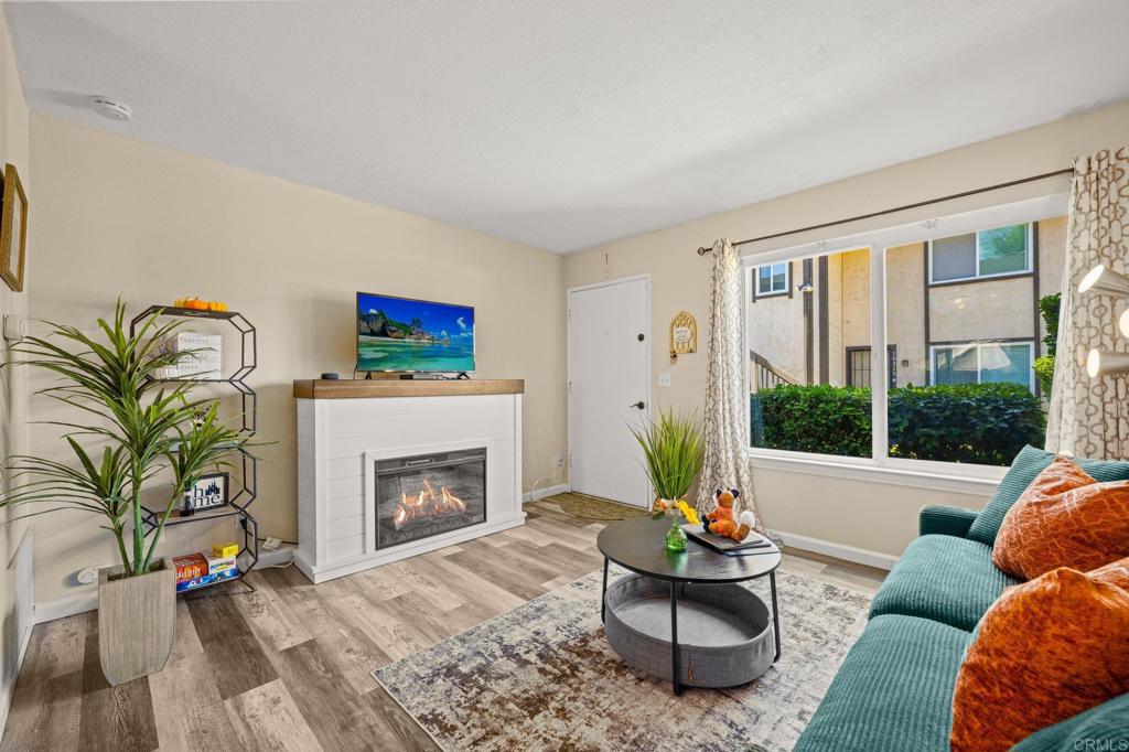 10323 Restful Court Santee, CA 92071 - Photo 3 of 30 a living room with furniture and a fireplace
