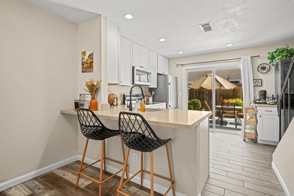 10323 Restful Court Santee, CA 92071 - Photo 8 of 30 a view of a livingroom with furniture window and wooden floor