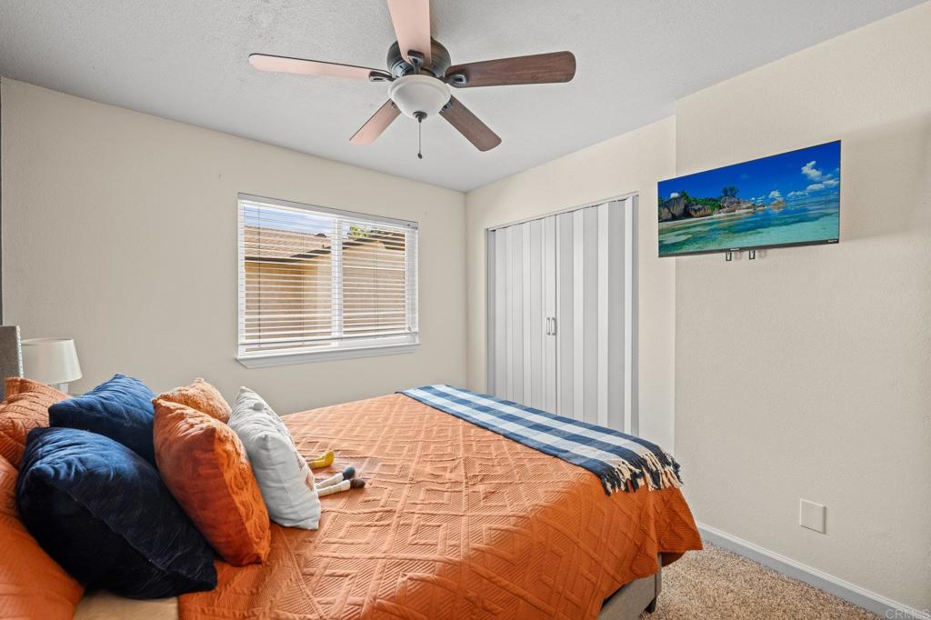 10323 Restful Court Santee, CA 92071 - Photo 10 of 30 a bedroom with a bed dresser and a window