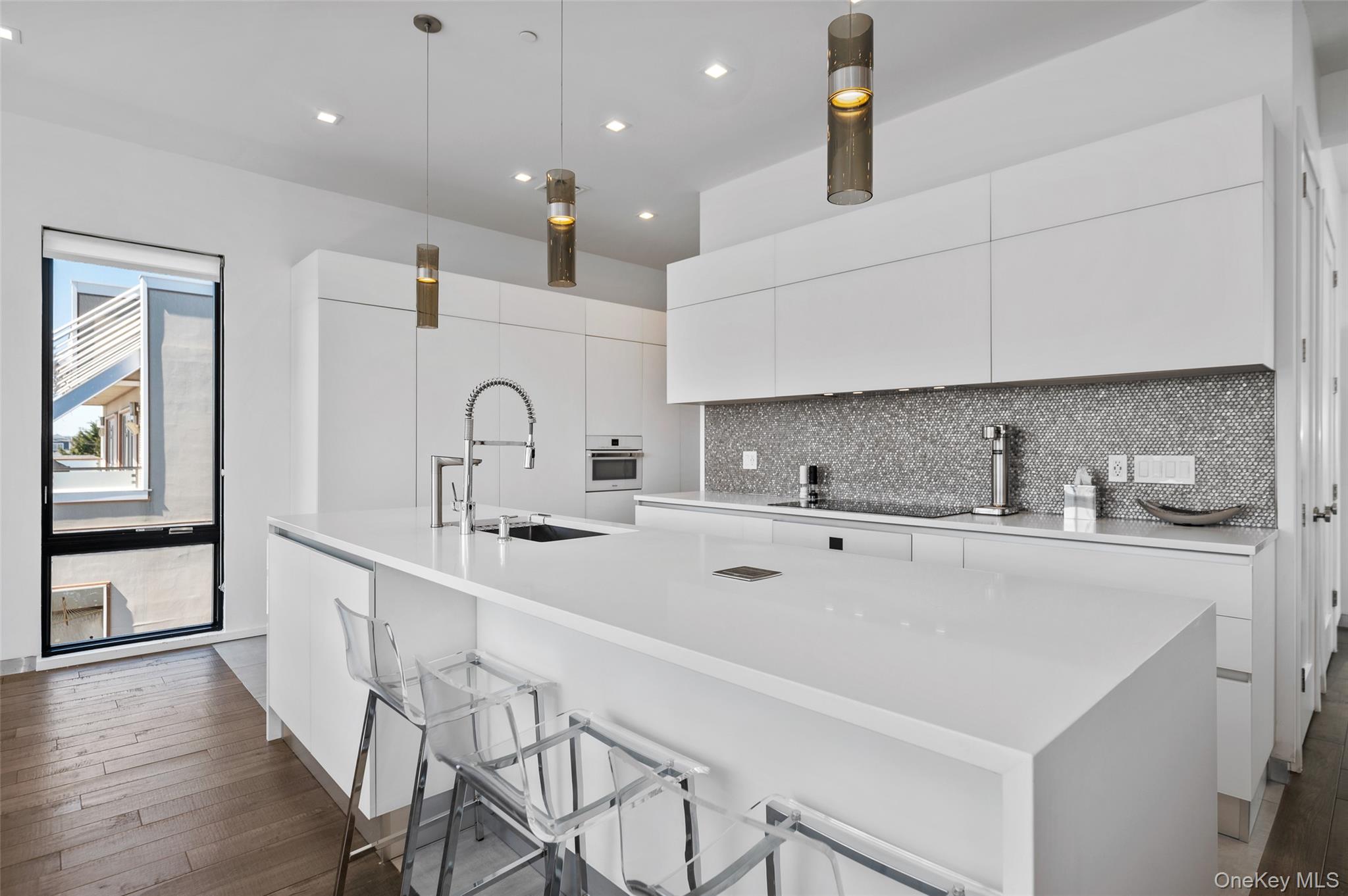 46 Nantwick Street Lido Beach, NY 11561 - Photo 14 of 50 a kitchen with stainless steel appliances a sink stove and cabinets