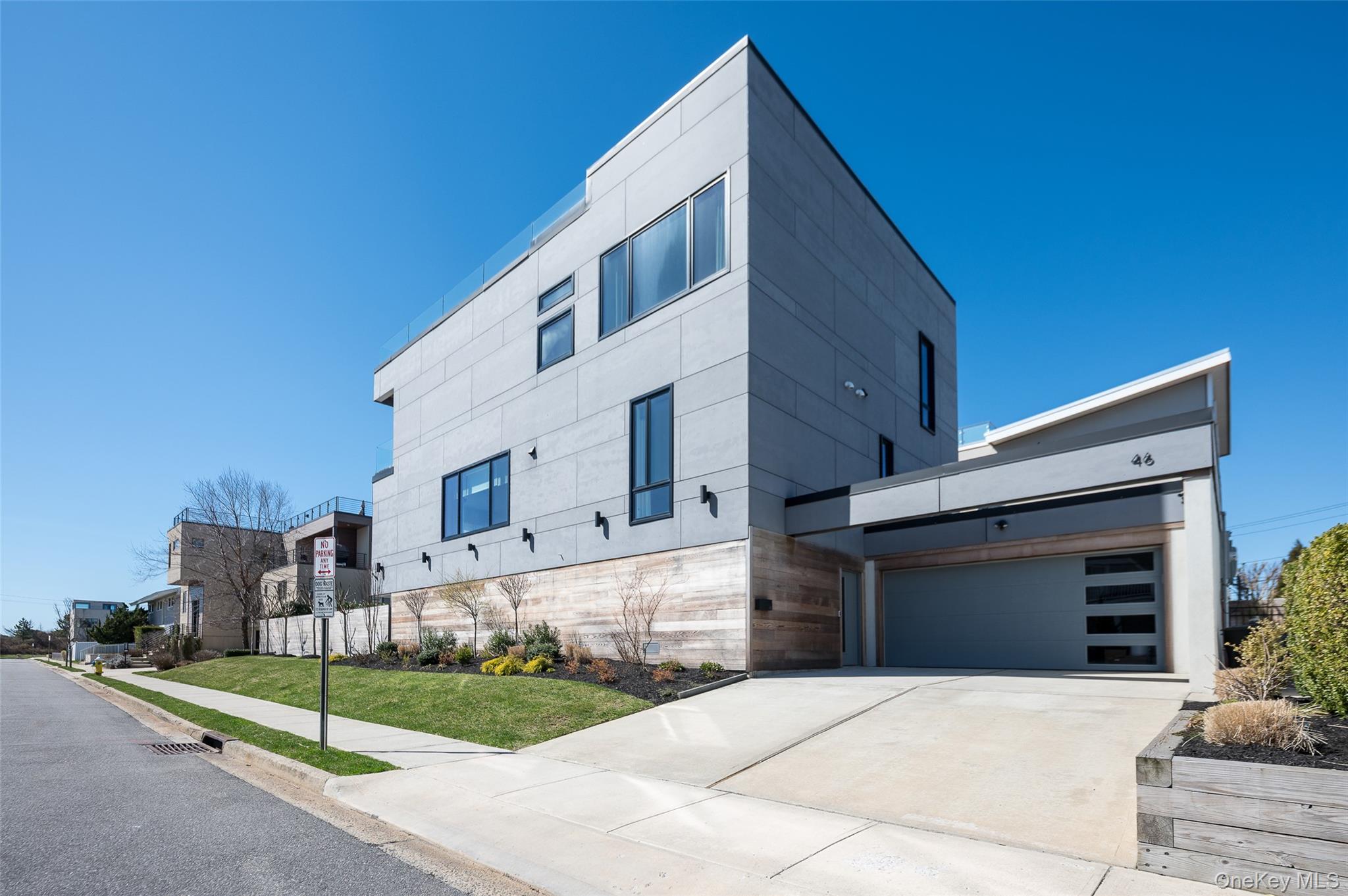 46 Nantwick Street Lido Beach, NY 11561 - Photo 2 of 50 a front view of a house with a yard
