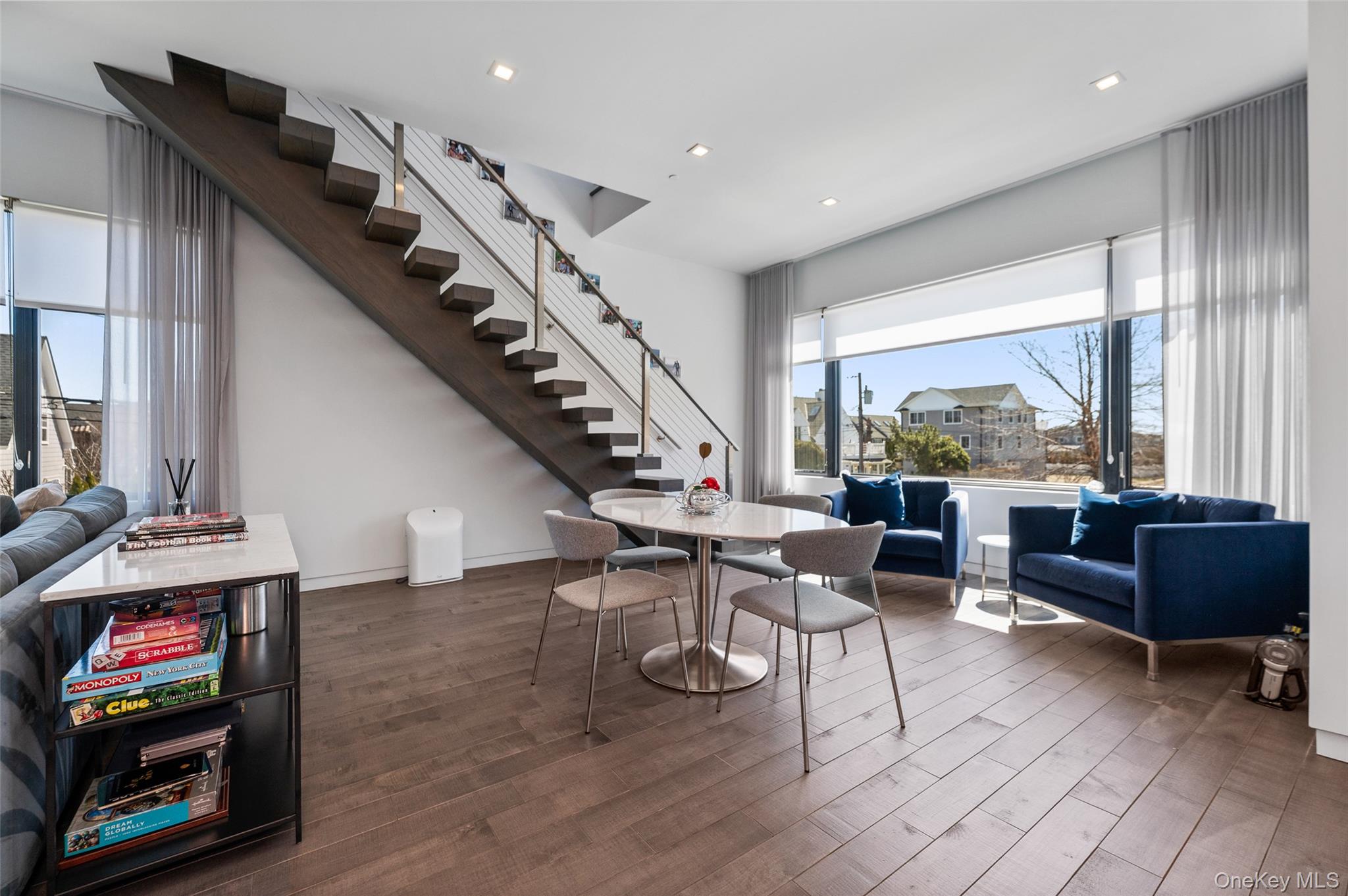 46 Nantwick Street Lido Beach, NY 11561 - Photo 24 of 50 a living room with furniture and a floor to ceiling window
