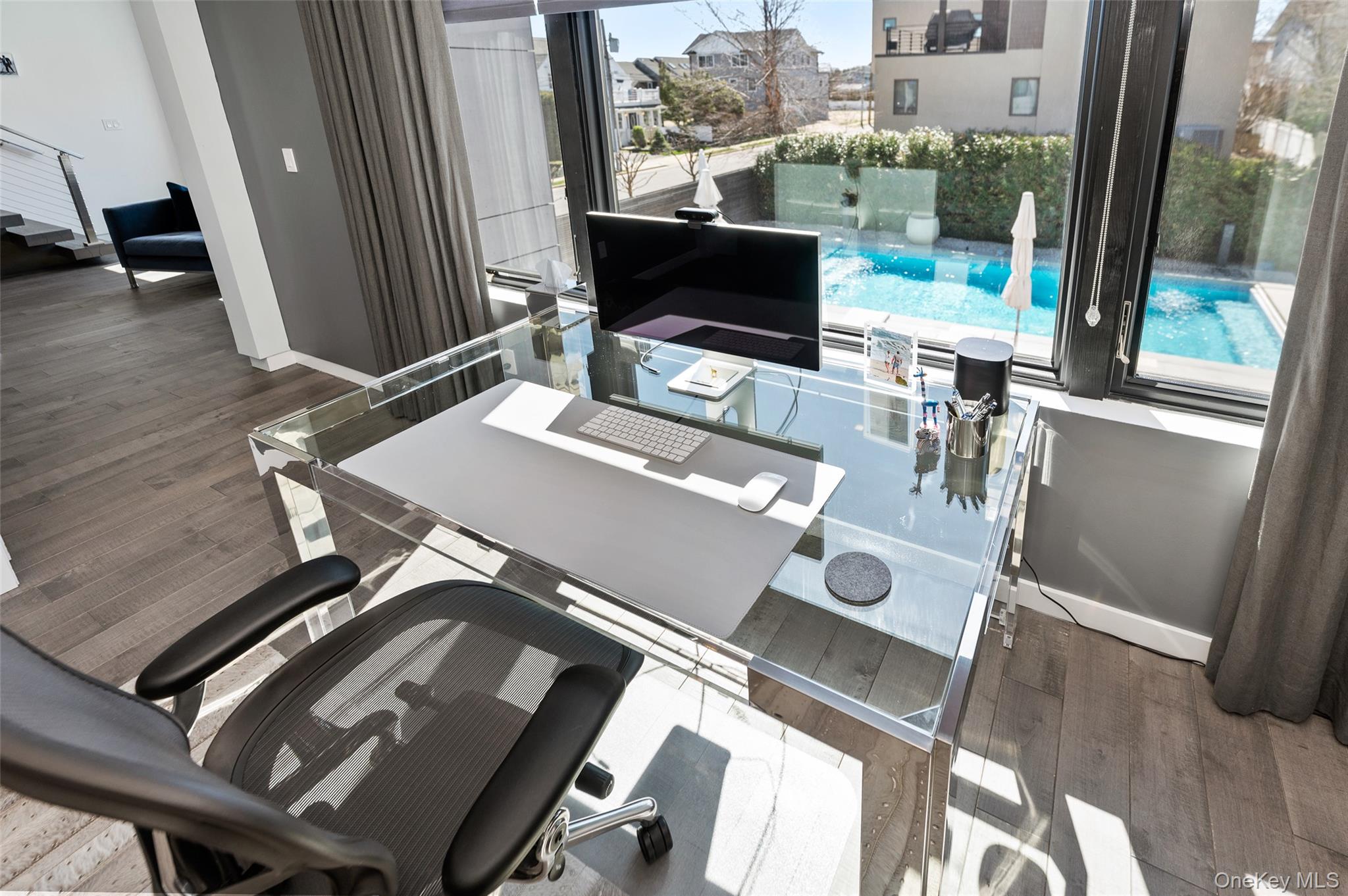 46 Nantwick Street Lido Beach, NY 11561 - Photo 27 of 50 a view of a workspace with furniture and a floor to ceiling window