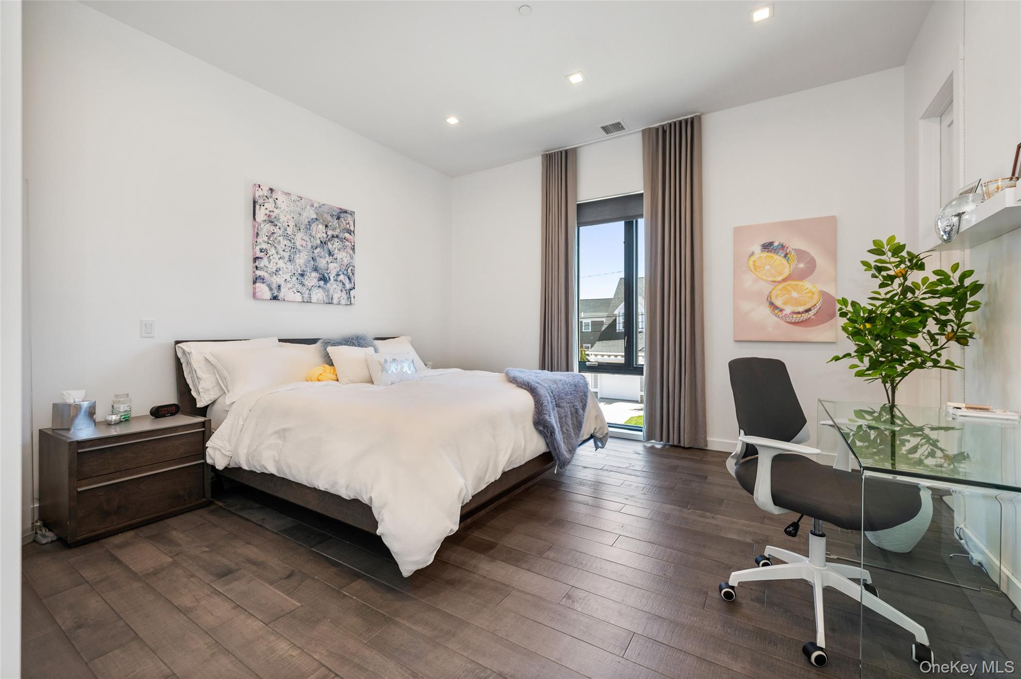 46 Nantwick Street Lido Beach, NY 11561 - Photo 29 of 50 a bedroom with a bed and a potted plant