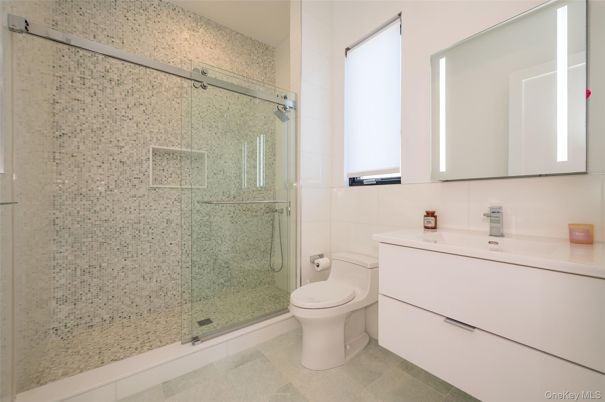 46 Nantwick Street Lido Beach, NY 11561 - Photo 30 of 50 a bathroom with a sink a toilet and shower