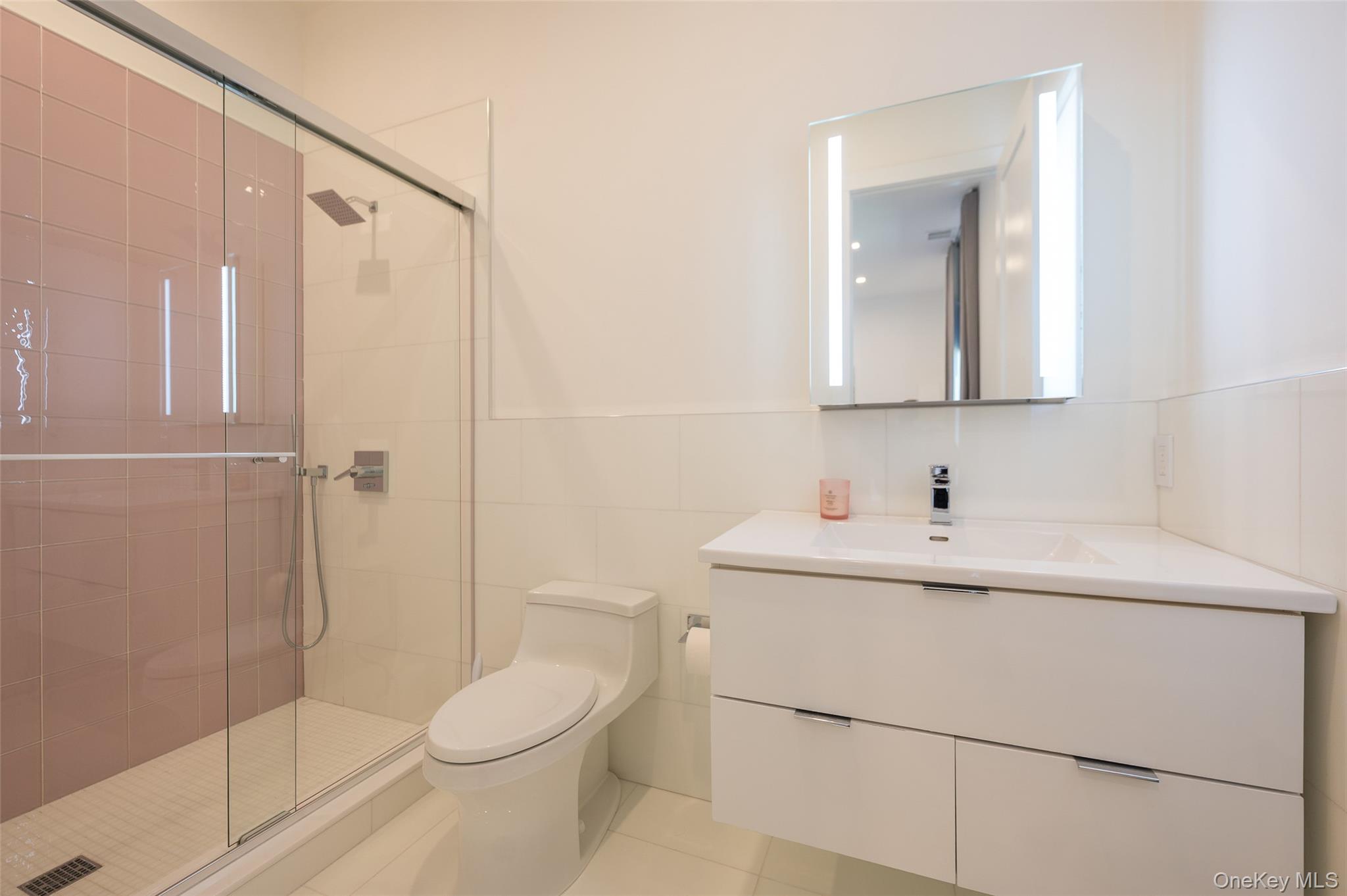 46 Nantwick Street Lido Beach, NY 11561 - Photo 32 of 50 a bathroom with a sink a toilet and shower