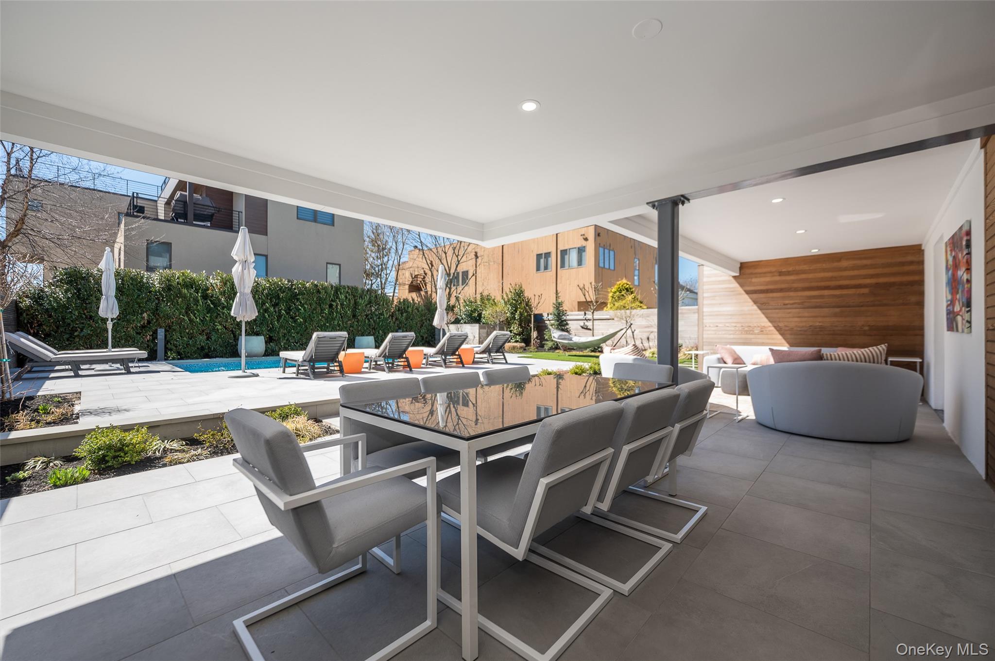 46 Nantwick Street Lido Beach, NY 11561 - Photo 42 of 50 a dining room with furniture and a floor to ceiling window