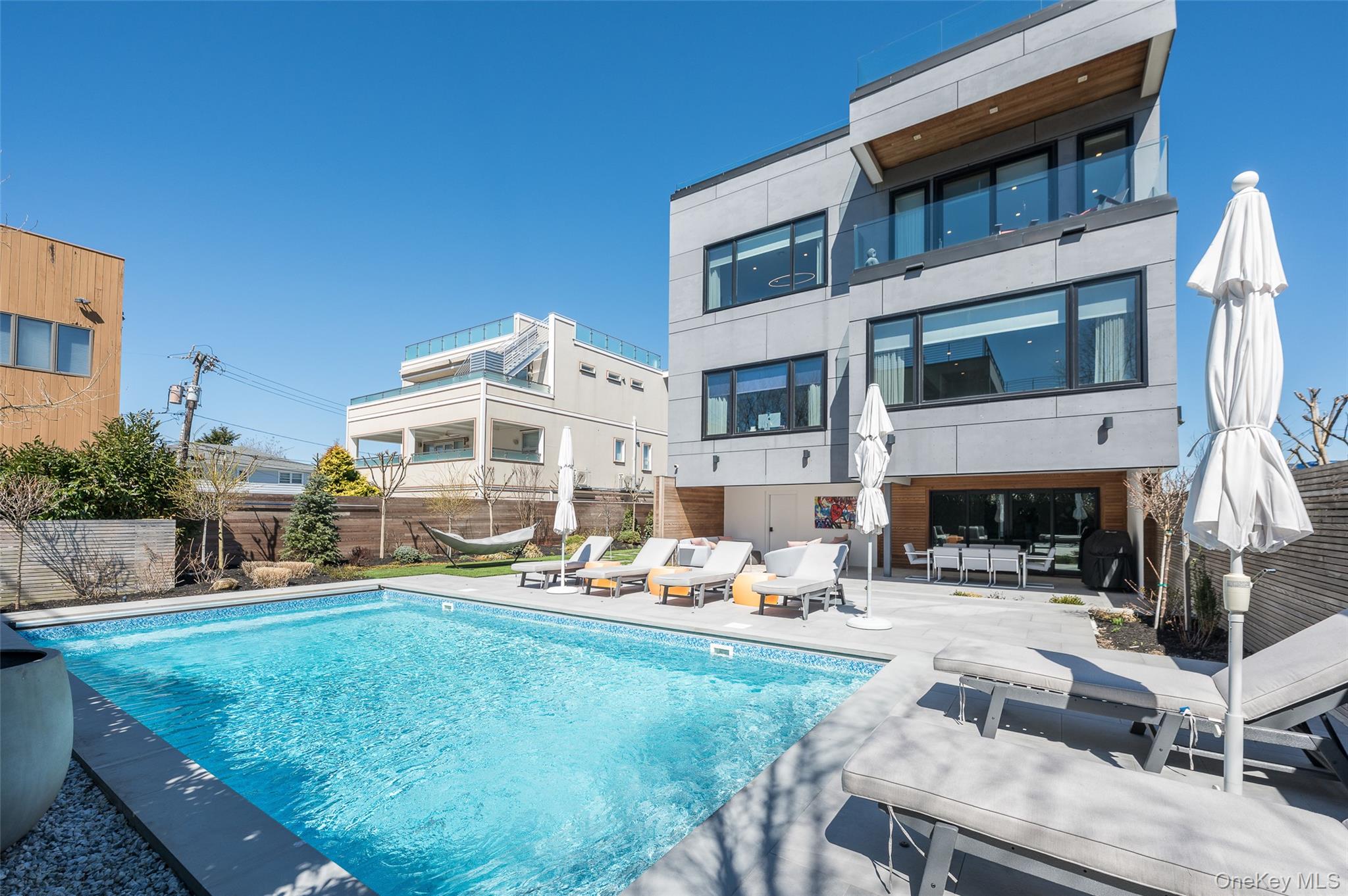 46 Nantwick Street Lido Beach, NY 11561 - Photo 45 of 50 a building outdoor space with patio furniture and a fireplace