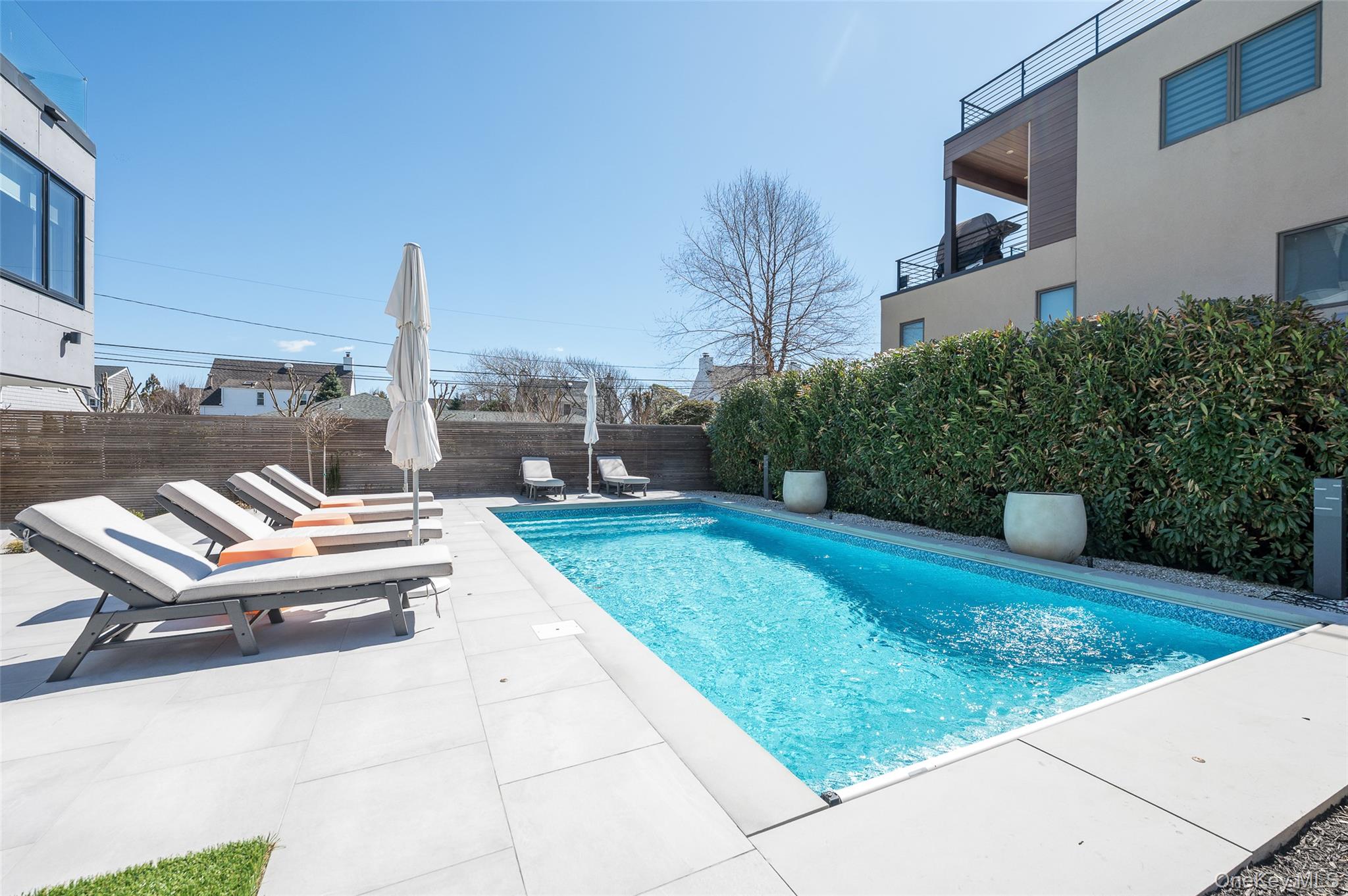 46 Nantwick Street Lido Beach, NY 11561 - Photo 46 of 50 a view of a patio with a table and chairs