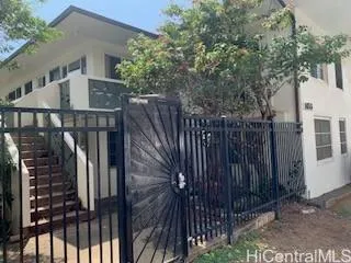 a view of balcony with wooden floor and fence