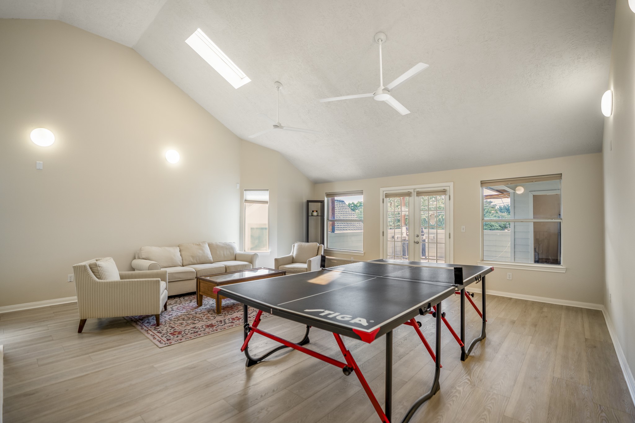 4236 Drake Street Houston, TX 77005 - Photo 32 of 43 My absolute favorite part of this home is up on the third floor. This current family has made so many memories up here—from epic game nights and movie marathons to intense ping pong matches and hosting friends on this spacious covered terrace with the custom bar.