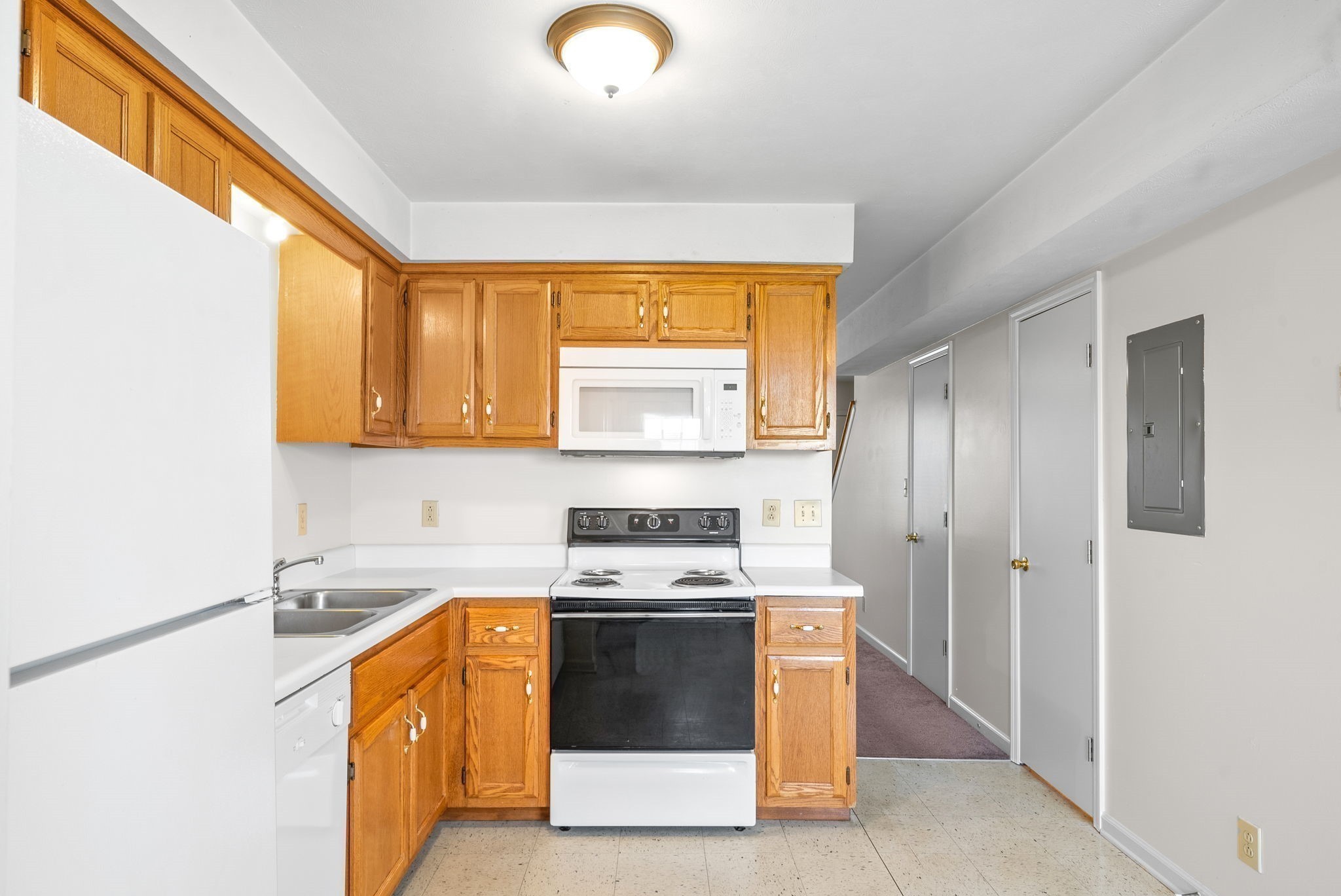 630 Needmore Road, Unit C Clarksville, TN 37040 - Photo 10 of 24 a kitchen with stainless steel appliances a stove a sink and a microwave