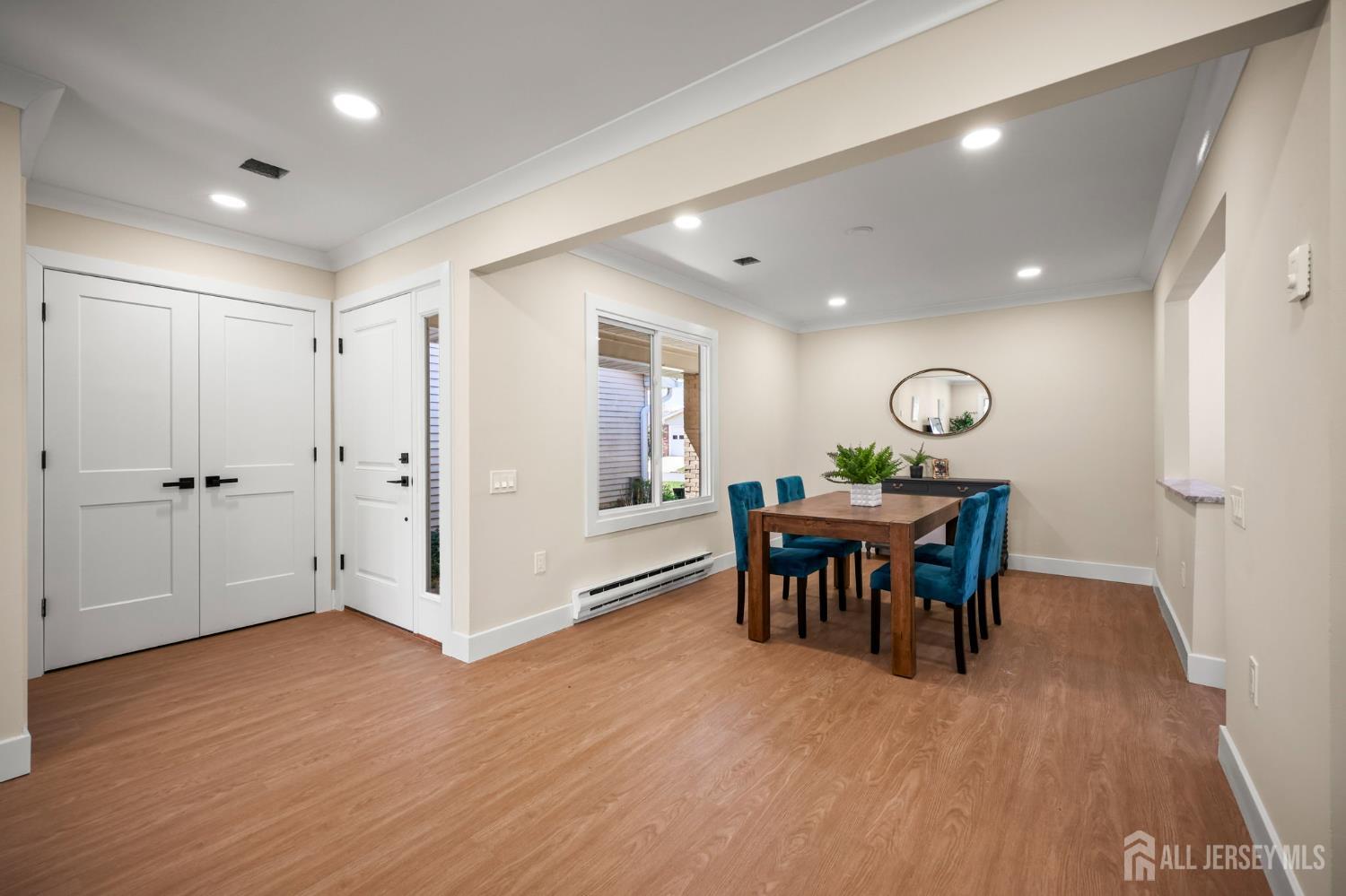 701 Croydon Road, Unit A Monroe Township, NJ 08831 - Photo 6 of 34 a view of a dining room with furniture and wooden floor