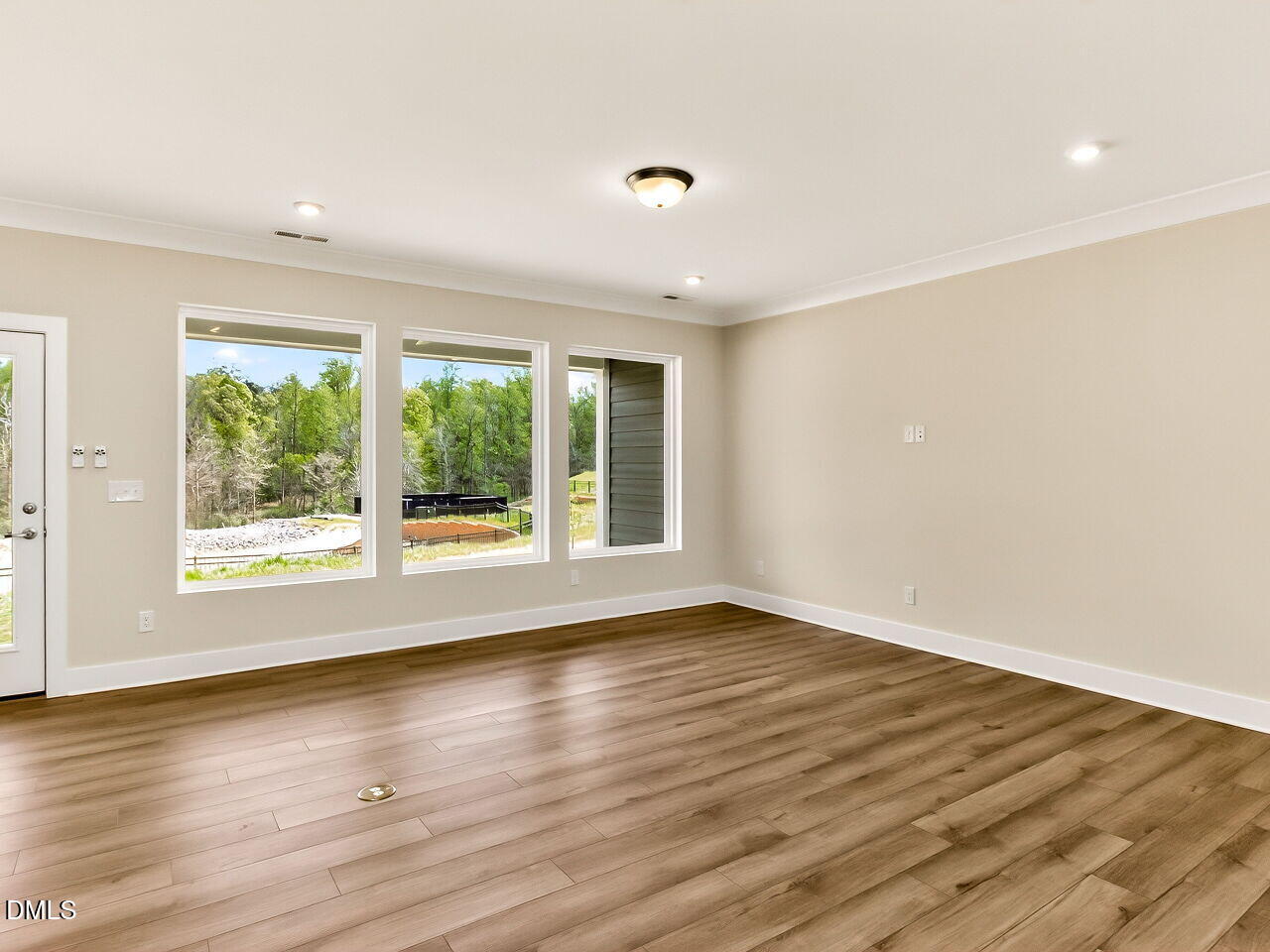 62 Raspberry Run Pittsboro, NC 27312 - Photo 11 of 55 a view of an empty room with wooden floor and a window
