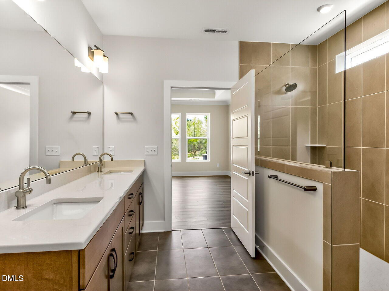 62 Raspberry Run Pittsboro, NC 27312 - Photo 14 of 55 a bathroom with a sink a large mirror and a shower