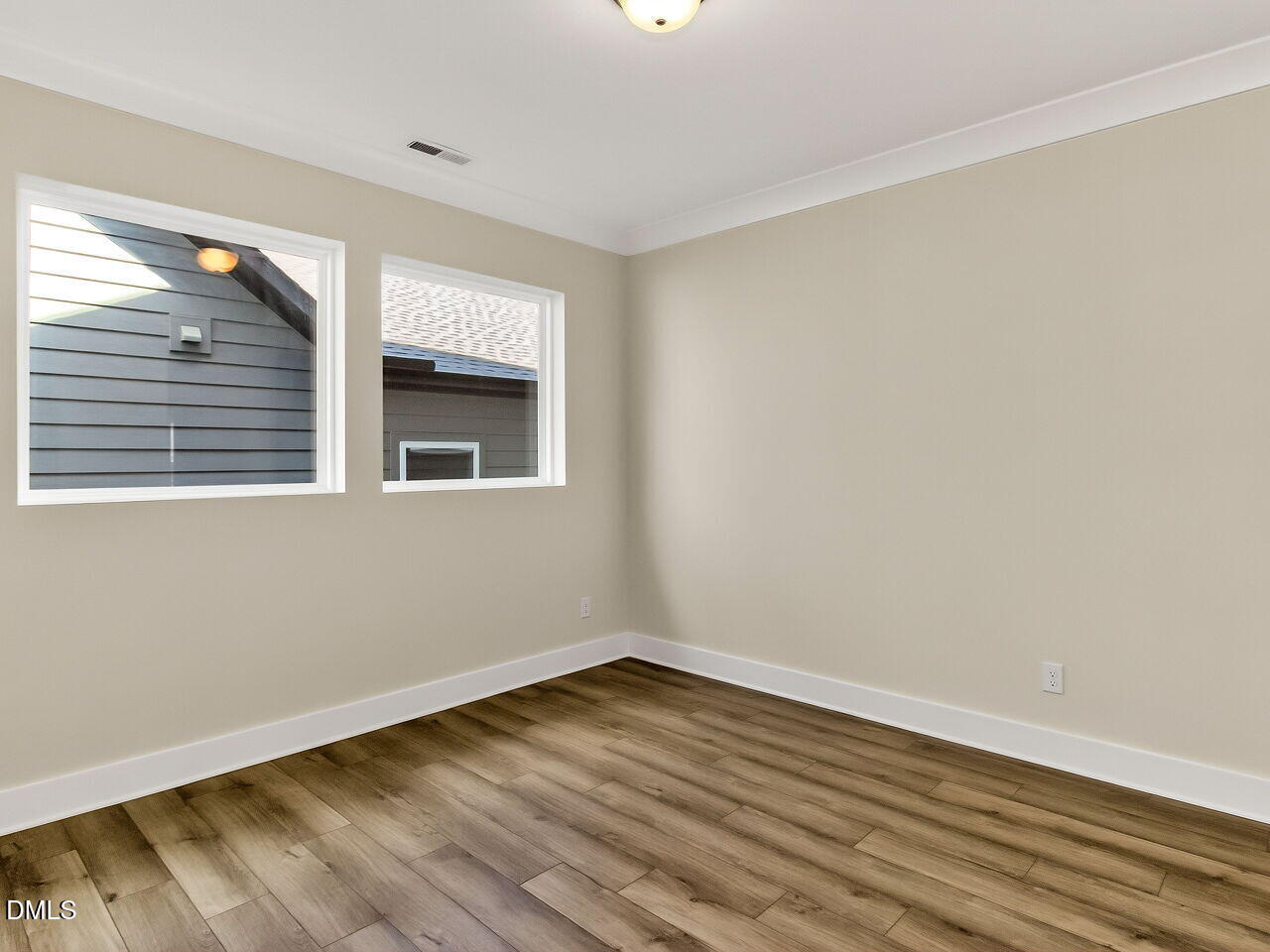 62 Raspberry Run Pittsboro, NC 27312 - Photo 20 of 55 a view of an empty room with wooden floor and a window