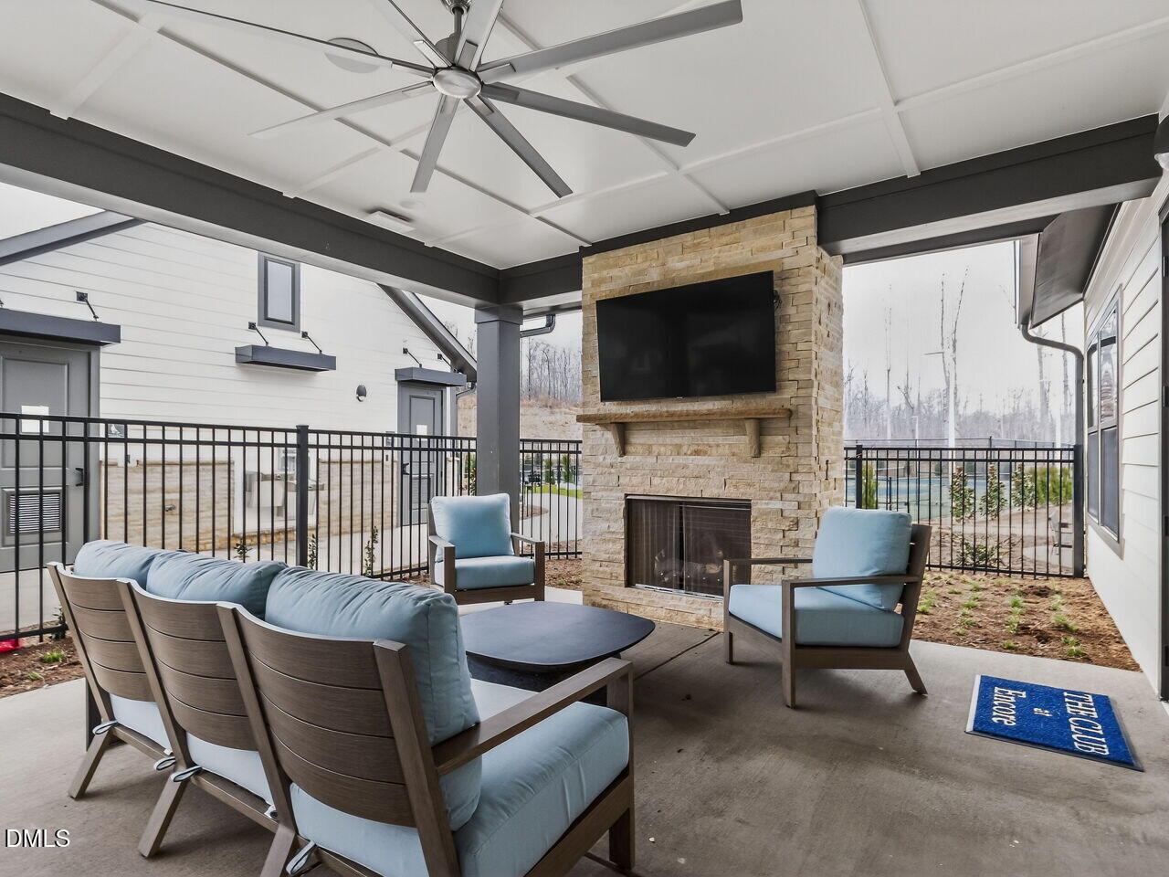 62 Raspberry Run Pittsboro, NC 27312 - Photo 44 of 55 a living room with furniture a flat screen tv and a fireplace