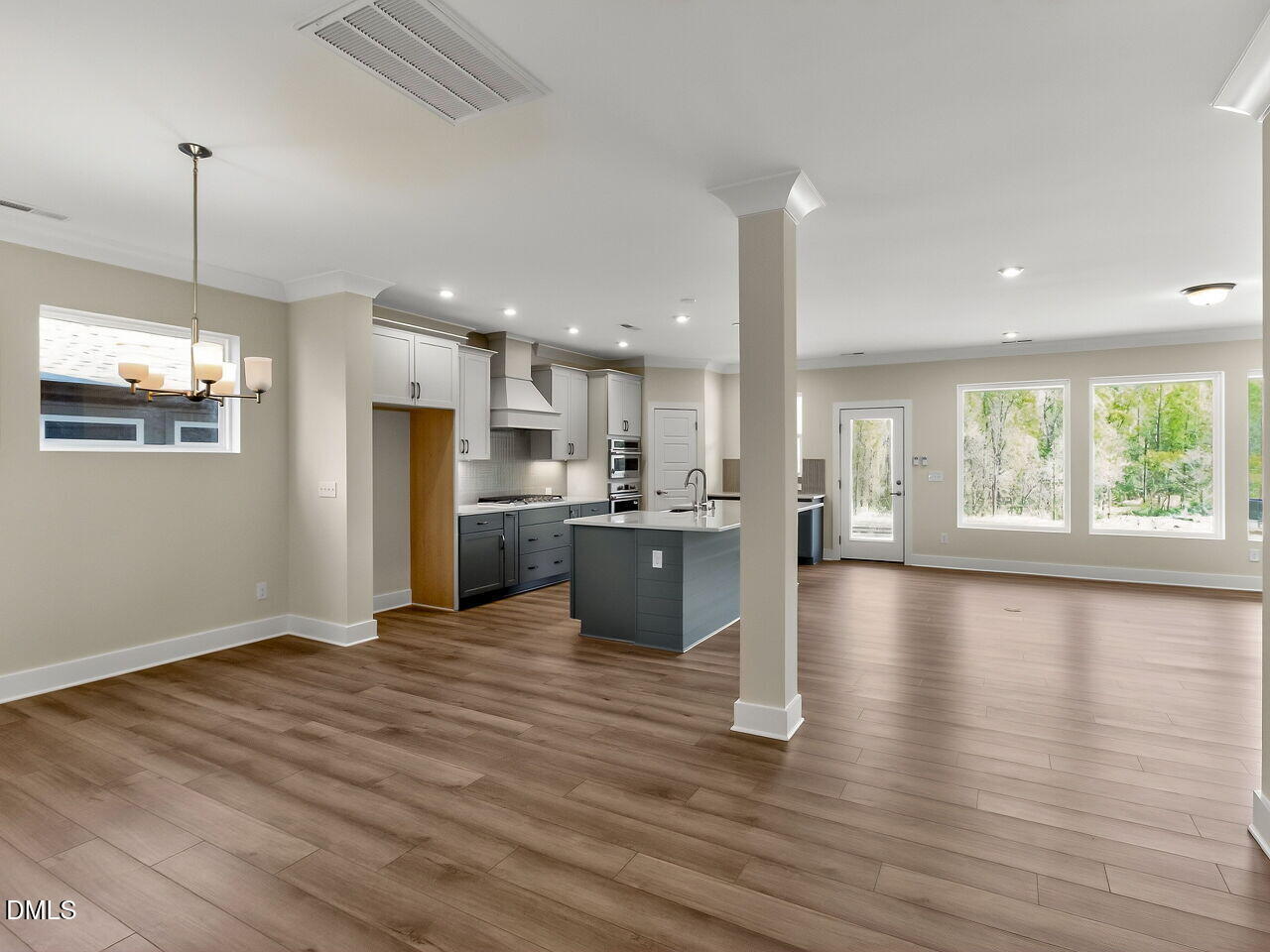 62 Raspberry Run Pittsboro, NC 27312 - Photo 5 of 55 a view of kitchen with kitchen island wooden floors appliances and cabinets