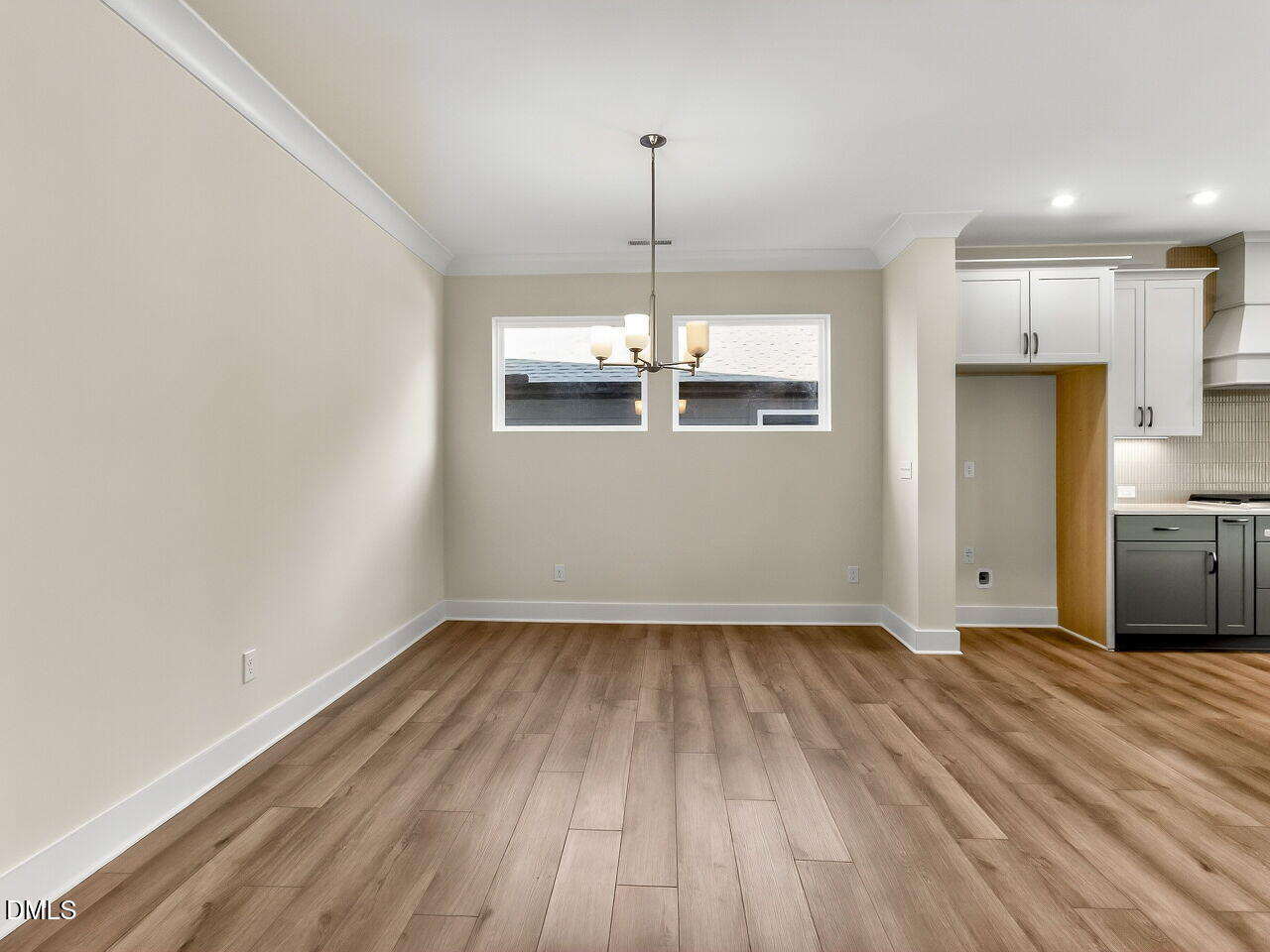 62 Raspberry Run Pittsboro, NC 27312 - Photo 6 of 55 a view of a kitchen with wooden floor and a ceiling fan