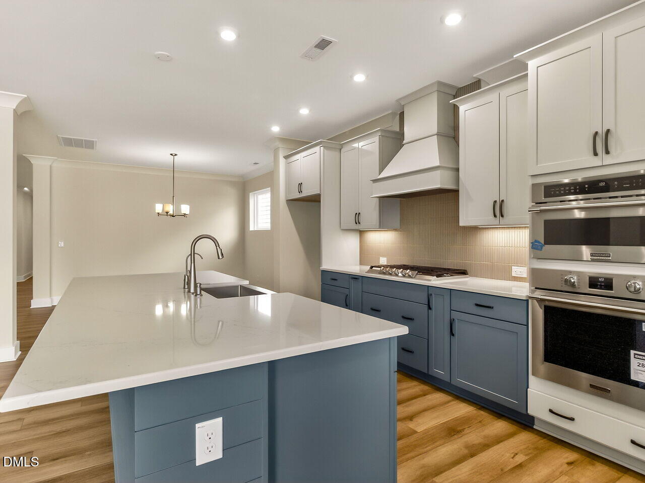 62 Raspberry Run Pittsboro, NC 27312 - Photo 10 of 55 a kitchen with stainless steel appliances granite countertop a sink a stove and a refrigerator