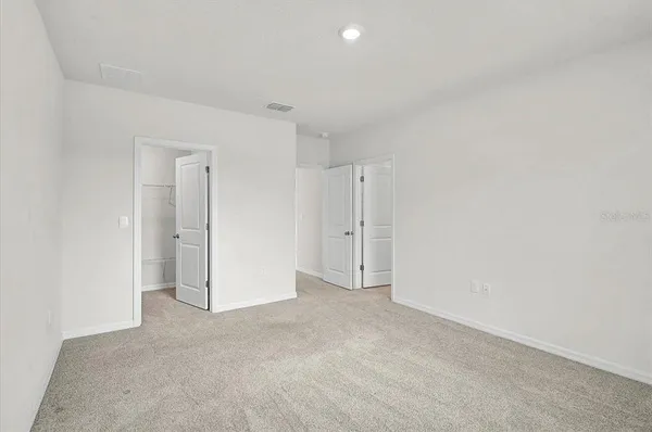 a bathroom with a sink double vanity and shower