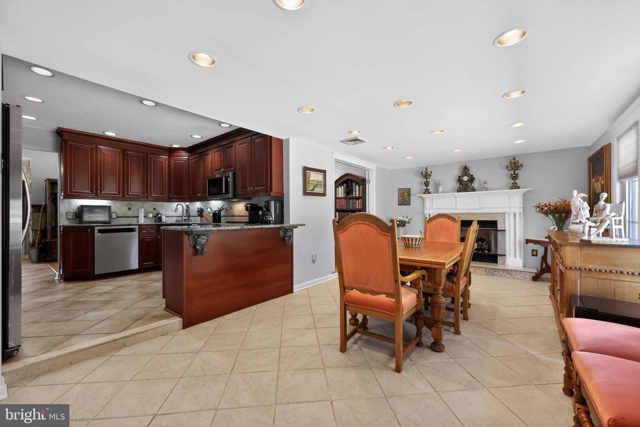 821 Beverly Road Rydal, PA 19046 - Photo 18 of 37 a living room with stainless steel appliances kitchen island granite countertop furniture and a view of kitchen