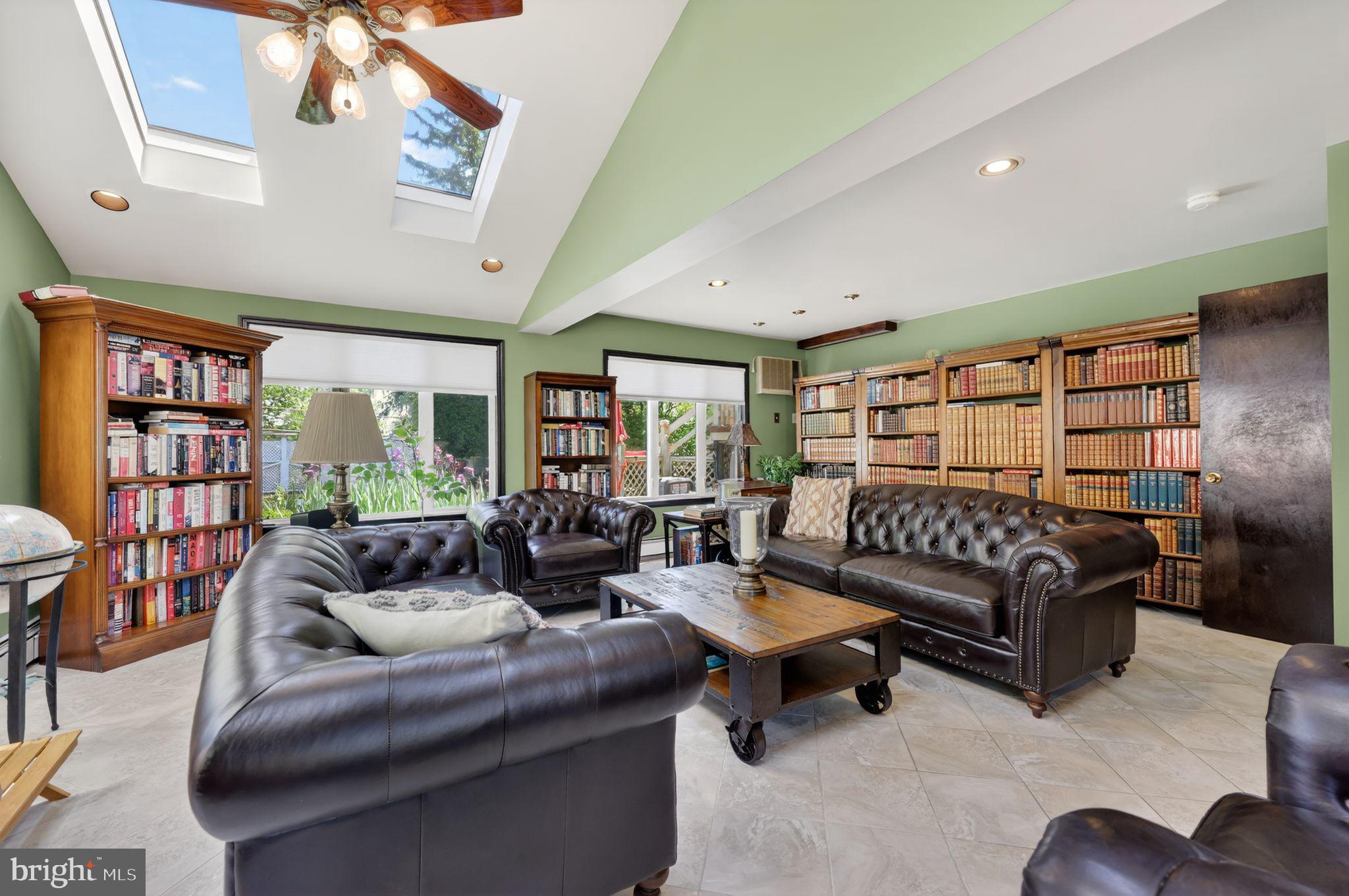 821 Beverly Road Rydal, PA 19046 - Photo 21 of 37 a living room with furniture and a book shelf