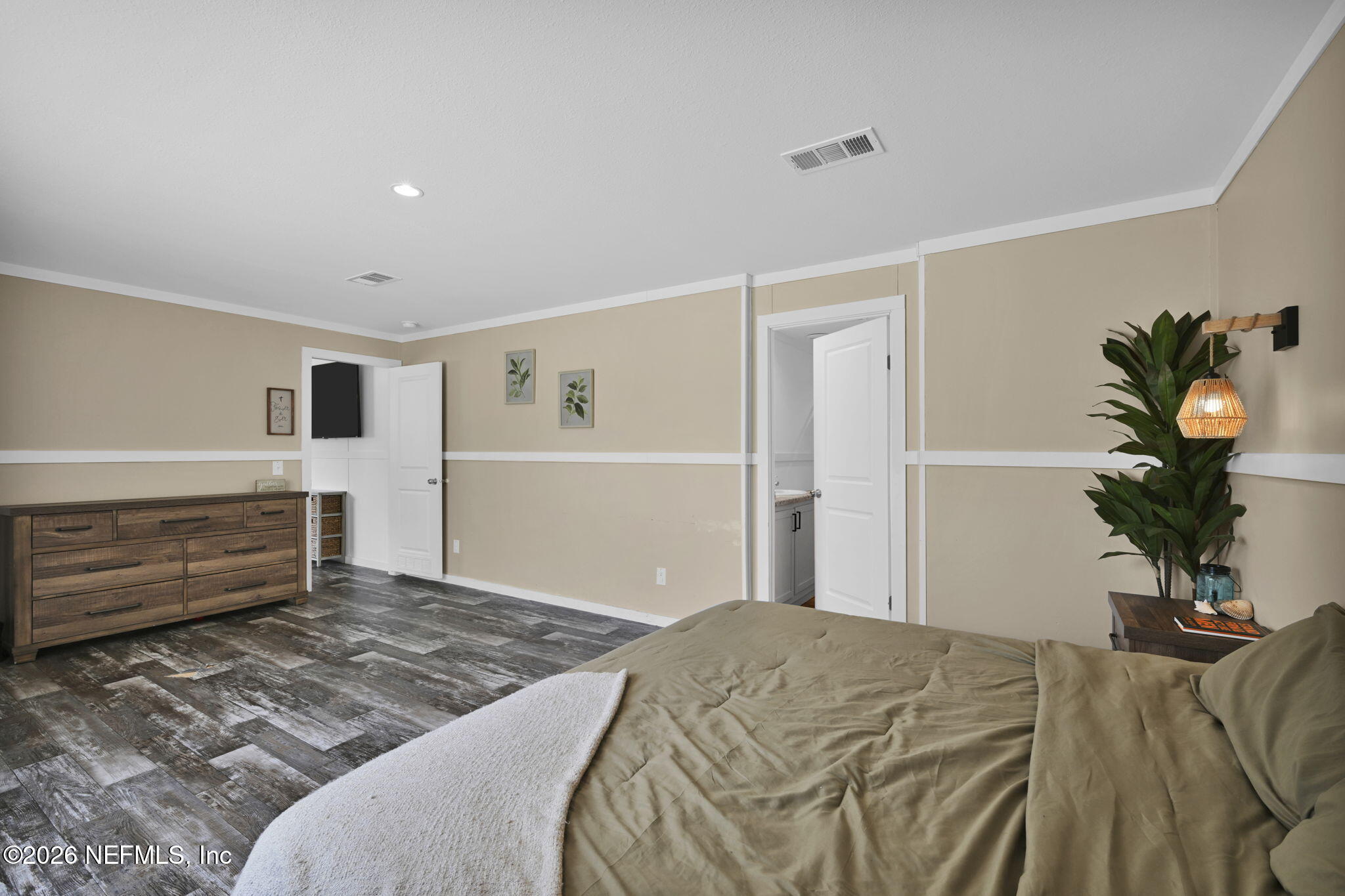 540783 Lem Turner Road Callahan, FL 32011 - Photo 30 of 36 a bedroom with a bed and a couch