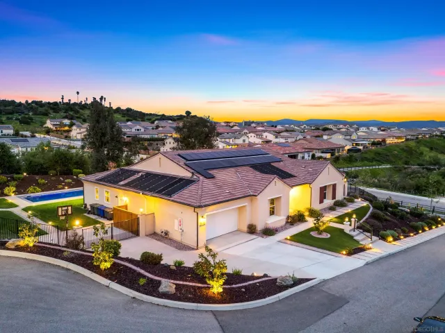 an aerial view of residential houses and outdoor space