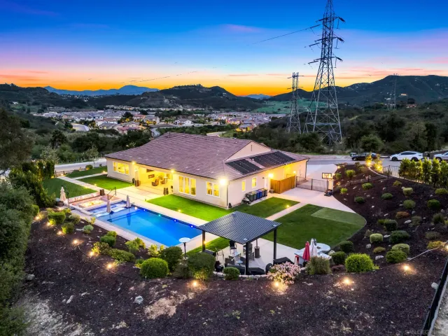 an aerial view of residential houses and outdoor space
