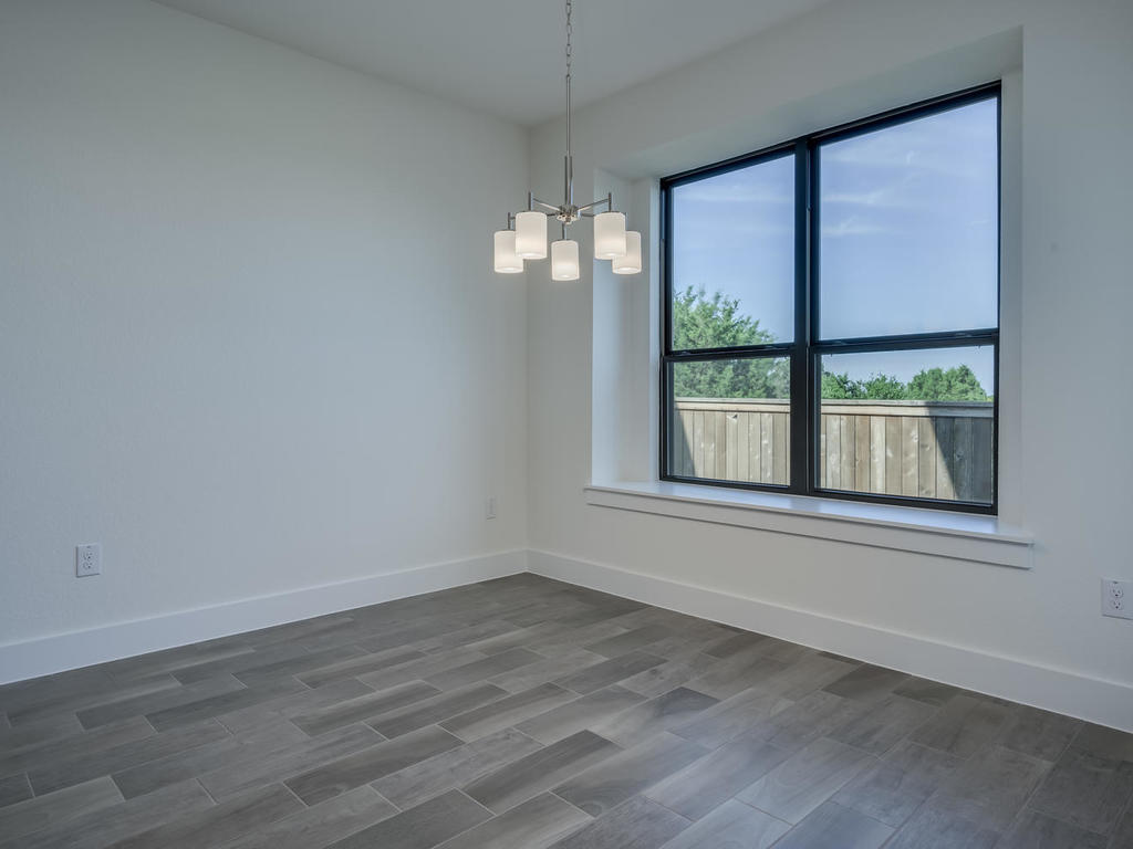 12327 Maypole Bend Austin, TX 78717 - Photo 18 of 30 wooden floor in an empty room with a window